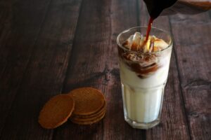 vecteezy a glass of iced milk poured espresso shot have biscuits 8026085 optimized